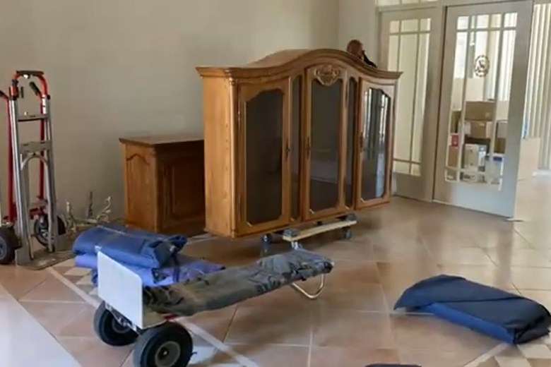 Rolling a china hutch out on the dolly