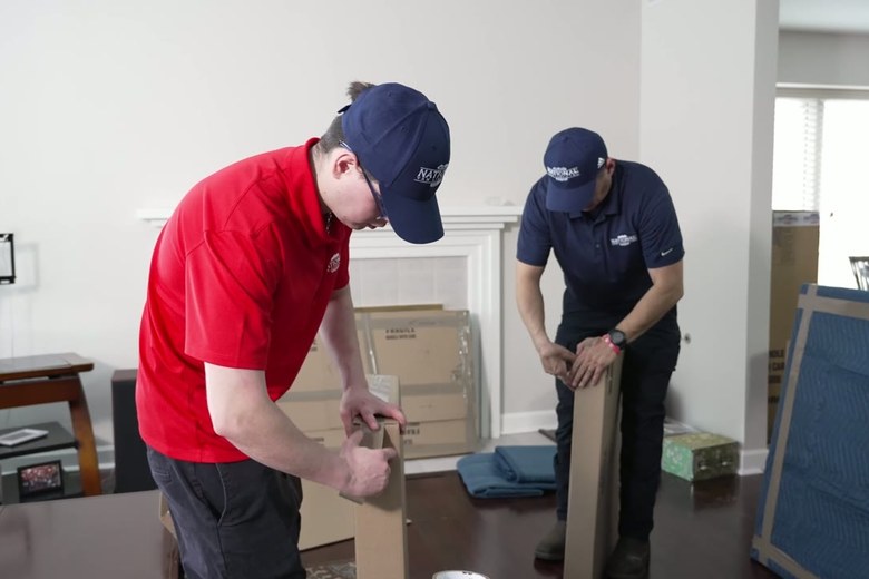Taping up cartons for the road